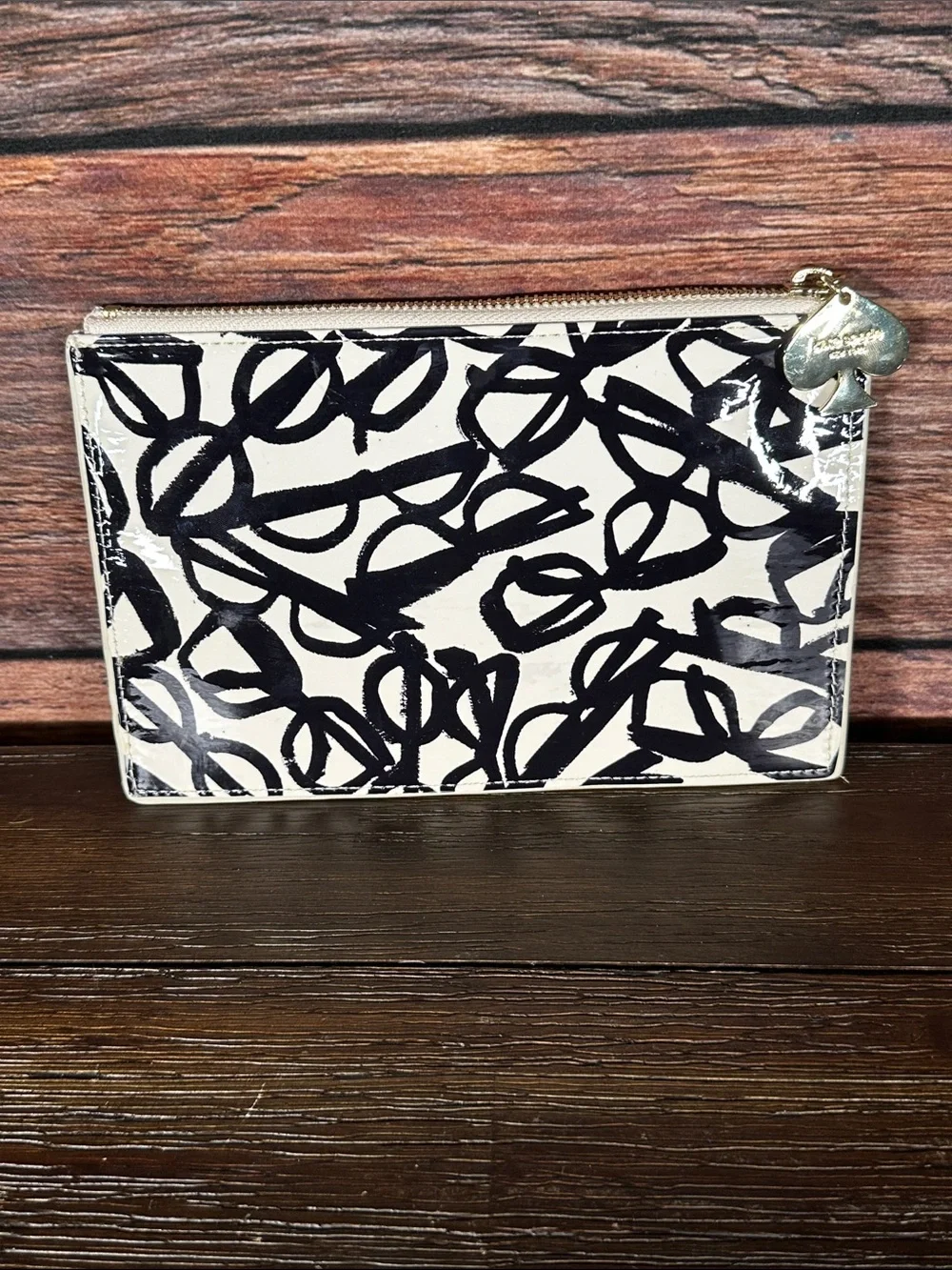 Kate Spade New York pouch features a whimsical 